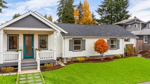 A two-story house with a front porch, a mailbox, and a well-maintained lawn. - Walk to the waterfront- Charmwood House  (Tacoma)