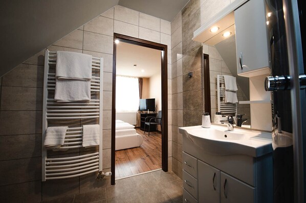 Shower, jetted bath, towels, soap