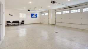 A spacious indoor area with a polished floor, a flag, and a flagpole.
