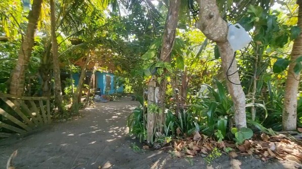 Stroll through the lush garden to a charming retreat.