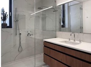 Shower, eco-friendly toiletries, hair dryer, towels