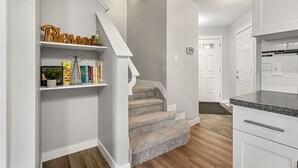 A clean, modern kitchen with white cabinetry and a granite countertop. - New Edmonton House 10 mins to Airport, Super close to best places in Edmonton (Edmonton)