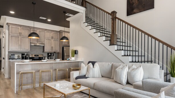 A modern kitchen with stainless steel appliances, a central island, and pendant lighting. - Buck Creek BNB (Helena)