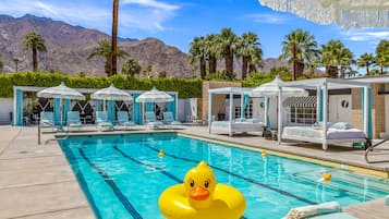 Outdoor pool, free cabanas, pool umbrellas
