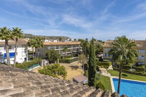 Guests can enjoy a Mediterranean-style hotel with a swimming pool, balconies, and lush gardens.