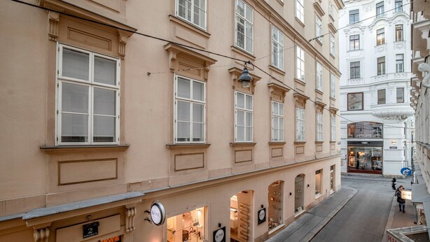 A building with multiple windows and a storefront.