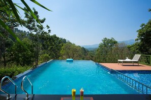Outdoor pool - Amrezy Resort and Spa by Stride Wayanad (Vythiri)