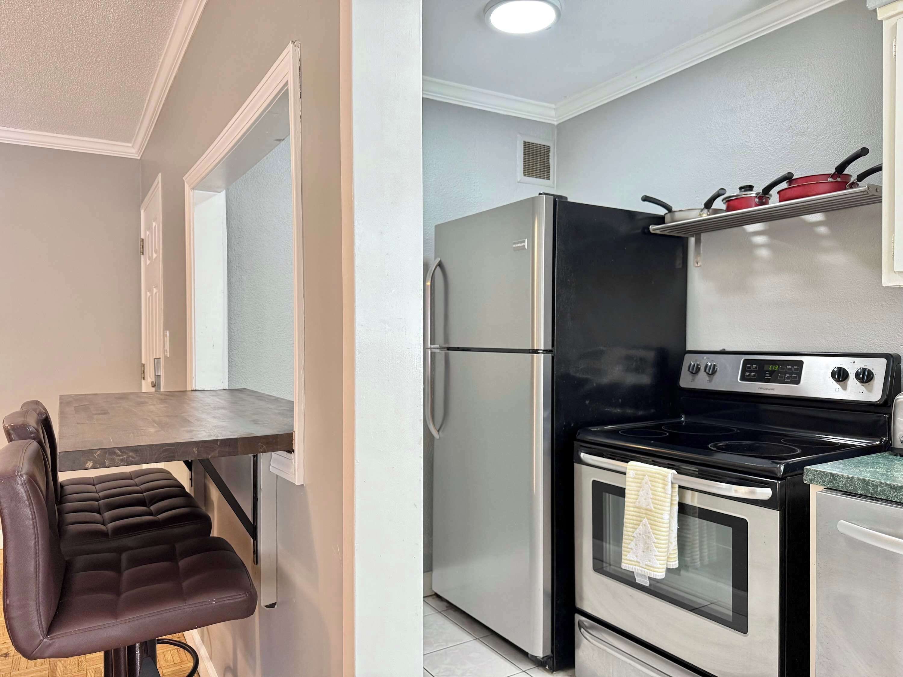 A compact kitchen with a refrigerator, stove, and a small countertop.