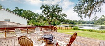 Updated waterfront home with spacious outdoor living area, gaming room