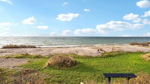 A beach with a bench and grassy area. - Gorgeous home in Assens with kitchen (Assens)