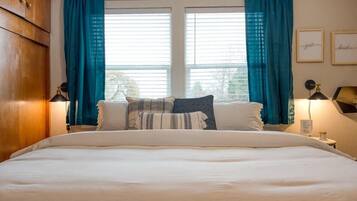 1 bedroom, desk, iron/ironing board, travel crib