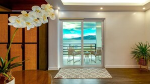 Panoramic Suite | Living area | LCD TV - Amor Laut (Mabini)