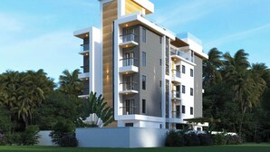 A modern multi-story hotel with balconies, a flat roof, and surrounded by lush greenery. - Hotel Southgate Goa (Calangute)