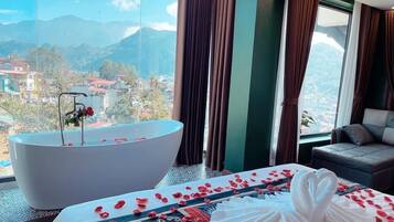 Habitación Deluxe | Camas con pillow-top, minibar y caja de seguridad en la habitación