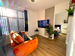 1 bedroom, desk, iron/ironing board, travel crib