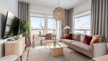 Deluxe Apartment | Living area | 60-inch LED TV with cable channels, heated floors