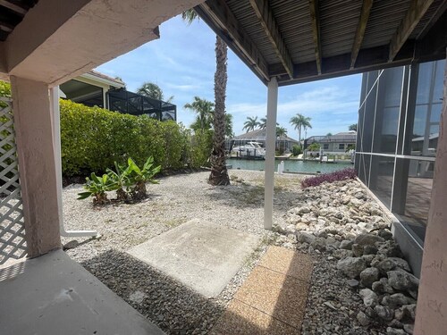 Enjoy Island Living at this Cozy Waterfront Raised Ranch style Home..