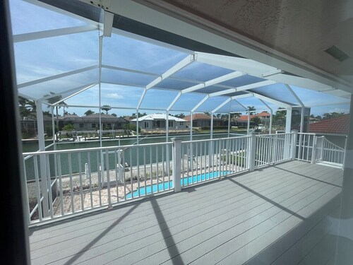 Enjoy Island Living at this Cozy Waterfront Raised Ranch style Home..