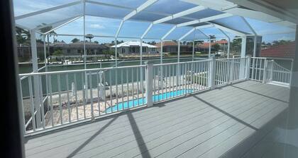 Enjoy Island Living at this Cozy Waterfront Raised Ranch style Home..