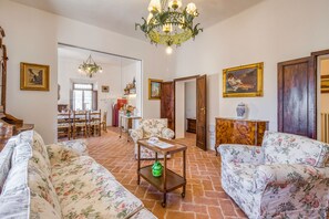 Family House, Multiple Bedrooms, Mountainside (Chianti Classico Home Panoramic View) | Living area | 21-inch flat-screen TV with cable channels, TV - Chianti Classico Home Panoramic View (Castellina in Chianti)