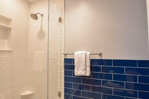 Shower, hair dryer, towels, shampoo