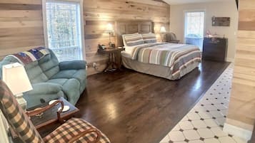 1 dormitorio y tabla de planchar con plancha