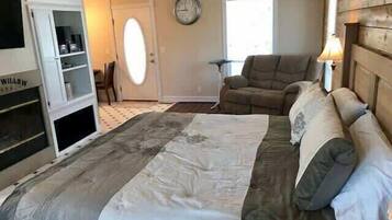 1 dormitorio y tabla de planchar con plancha