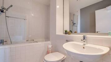 Shower, hair dryer, towels, shampoo