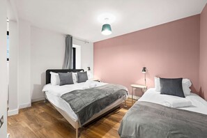 1 bedroom, desk, iron/ironing board, travel crib