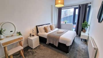 1 bedroom, desk, iron/ironing board, travel crib