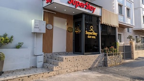 A SuperStay hotel with a modern facade, a visible entrance, and a sign indicating it is a hotel. - Stay Suite Hotel (Eyup)