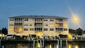 A multi-story hotel with a flat roof, large windows, and balconies. - Stunning Waterfront 2-bdrm condo with Executive Office & Boat Lift (Punta Gorda)