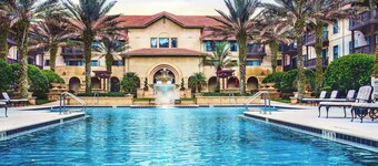 1BR - fountain view-balcony-65 in TV-wood floors-heated pool-hot tub!