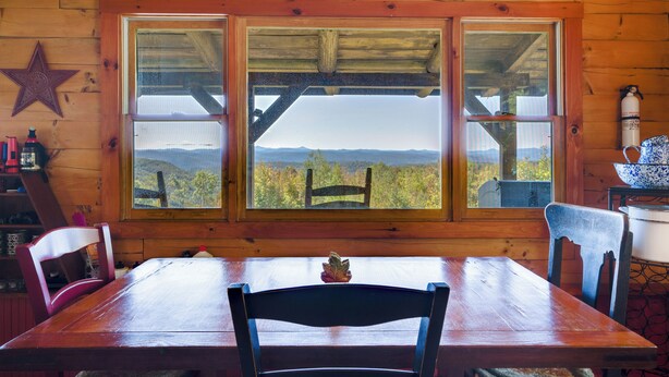 A wooden cabin with a large window overlooking a mountainous landscape. - Remote Escape: Vermont Cabin w/ Mountaintop Views! (Sharon)
