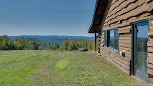 A log cabin with a large window and a view of mountains. - Remote Escape: Vermont Cabin w/ Mountaintop Views! (Sharon)