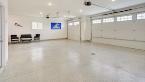 A spacious indoor area with a polished floor, a flag, and a flagpole.