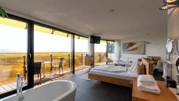 Superior Studio Suite | Bathroom | Separate bathtub and shower, jetted bath, hydromassage showerhead
