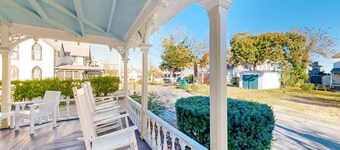 Historical house with wraparound porch, modern updates, enclosed yard, & W/D