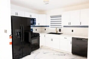 Fridge, microwave, oven, stovetop - Modern Cozy Vacation Home with Lounge/Event Space and Backyard  (Irvington)