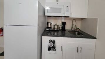 Fridge, microwave, stovetop, coffee/tea maker
