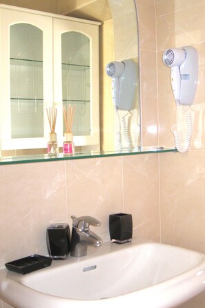 Hair dryer, towels, soap, shampoo