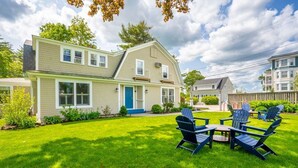A two-story house with a well-maintained lawn and outdoor seating area. - Beautiful Inn, Lighthouse Landing. Sleeps 18-20 (Ogunquit)