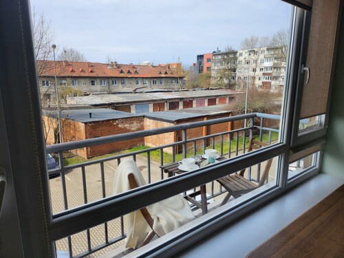 Home-spirit apartment with a panoramic window in the heart of Klaipėda!