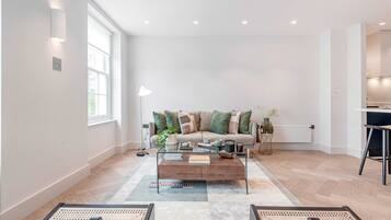 Basic Apartment, Multiple Beds | Living area | TV