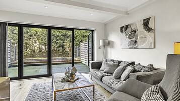 Basic Apartment, 1 Queen Bed | Living area | TV