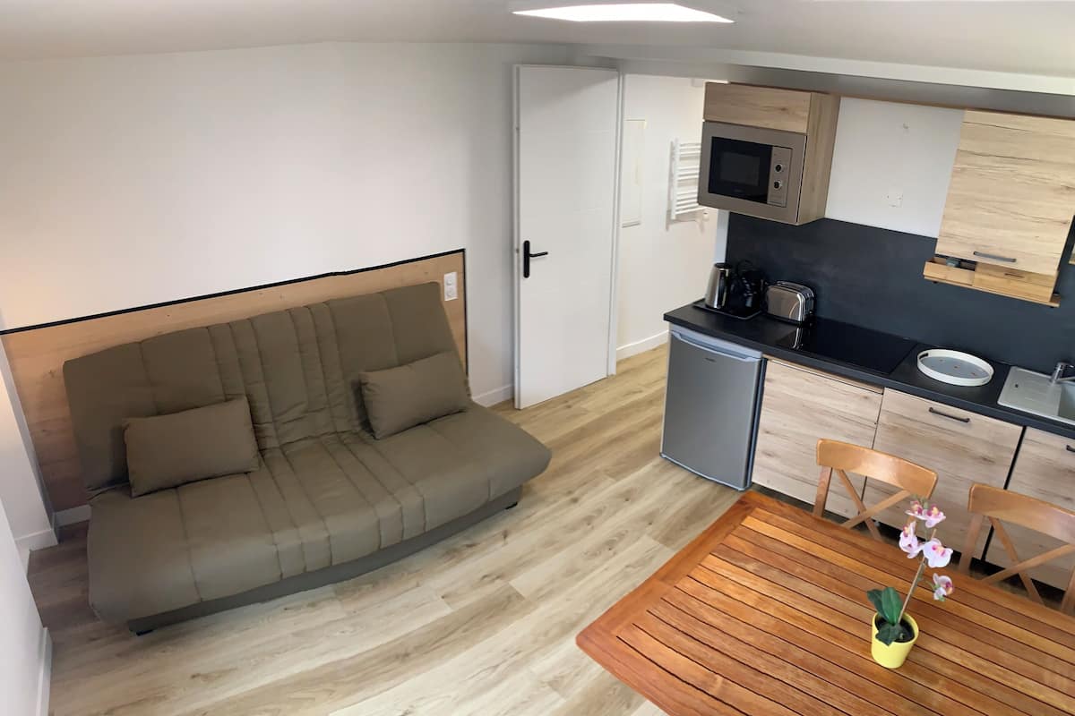 Superior Apartment | Living area | 71-cm LED TV with digital channels