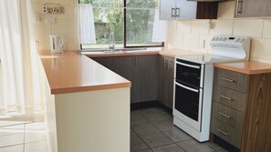 Coffee/tea maker, fridge, microwave, oven