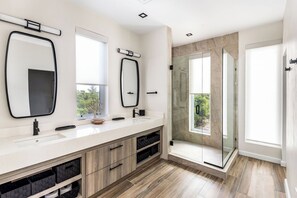 Shower, hair dryer, towels, shampoo