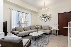 Premium Apartment, 1 Bedroom, Balcony, City View | Living room | 46-inch flat-screen TV with digital channels - Excellent 1bdr at Bahar 6 (Dubai)
