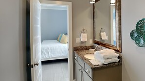 A bathroom with a sink, mirror, and towel rack. - Runnin Down A Dream by Southern Vacation Rentals (Miramar Beach)